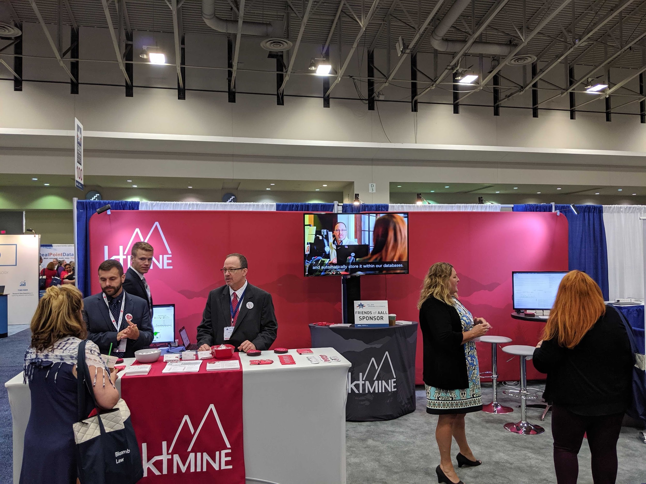 ktMINE talks to attendees in the booth at the 2019 AALL Annual Meeting